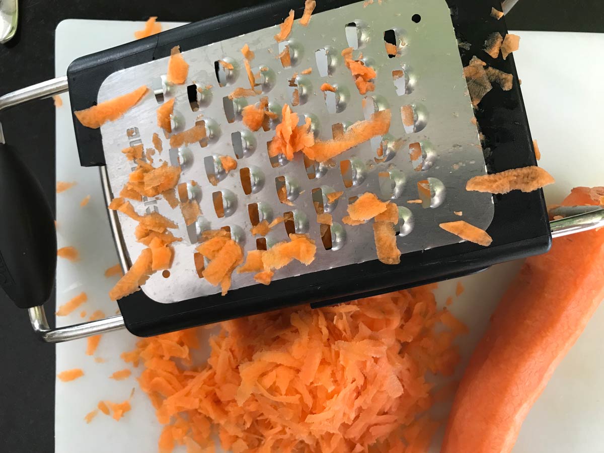 Grate carrots